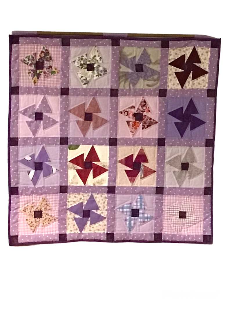 Quilt "Purple Hues Pinwheel" - a whirlwind of vintage charm and cozy comfort.